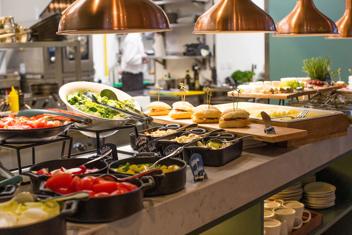 Breakfast buffet at PURO Warszawa Centrum with fresh salads and sandwiches