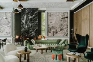 Design lobby lounge at PURO Warszawa Centrum with green velvet seating and Warsaw map art