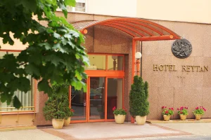 Entrance of Hotel Reytan in Warsaw with its orange canopy and greenery